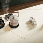 Close-up of a Caesarstone Isobellia white gold veined porcelain kitchen worktop