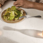 Close-up of Dreamy Carrara worktops in a dinner setting